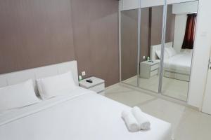 Homey 1BR at The Wave near Epicentrum Kuningan By Travelio