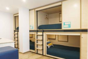 Bed in 4-Bed Mixed Dormitory Room room in TAKE SURF Hostel Conil
