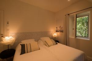 Appartements Le Nid Douillet, climatisation et parking prive : photos des chambres