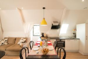 Appartements Le Nid Douillet, climatisation et parking prive : photos des chambres