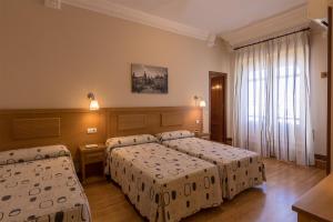 Triple Room with Private Bathroom room in Hostal Santillan