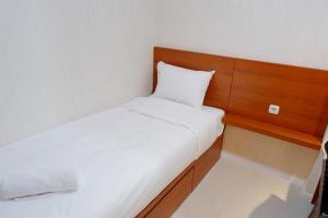 Cozy 2BR Bassura Apartment near Mall Bassura City By Travelio