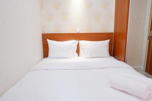 Cozy 2BR Bassura Apartment near Mall Bassura City By Travelio