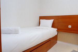 Cozy 2BR Bassura Apartment near Mall Bassura City By Travelio