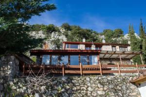 Stone house on the rock Parnassos Greece