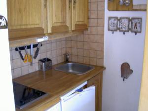 Les Menuires Résidence Brelin Skis aux pieds