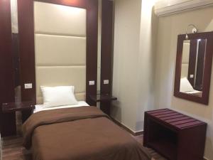 Single Room with Private Bathroom room in Grand Palace Hotel