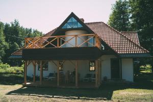 Three-Bedroom Holiday Home  room in Viesu nams Melnsils