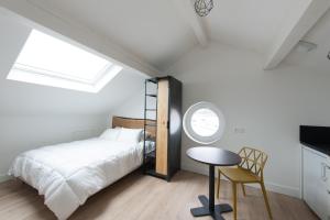 Appartements Le Jardin d Ambroise : photos des chambres