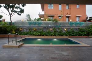 SaffronStays Dhyana - 3BR pet-friendly pool villa with Wi-Fi, indoor games and riverside trails in Wadas gated estate