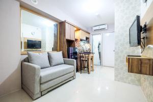 Classic 2BR Bassura City Apartment By Travelio