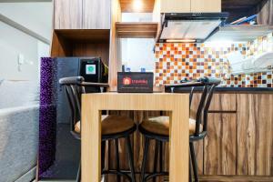 Classic 2BR Bassura City Apartment By Travelio