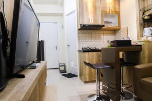 Well Designed 2BR Green Pramuka City Apartment By Travelio