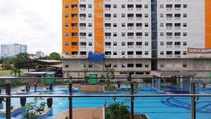 Well Designed 2BR Green Pramuka City Apartment By Travelio