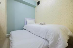 Comfy 2BR Bassura City Apartment near Mall By Travelio