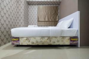 Comfy 2BR Bassura City Apartment near Mall By Travelio