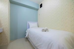 Comfy 2BR Bassura City Apartment near Mall By Travelio