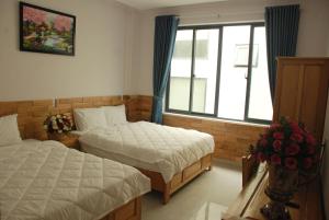 Phòng Deluxe Có 2 Giường Cỡ Queen (Deluxe Queen Room with Two Queen Beds)