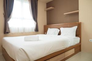 3BR with Sofa bed at Gateway Pasteur Apartment By Travelio