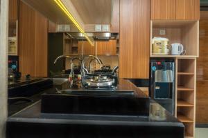 3BR with Sofa bed at Gateway Pasteur Apartment By Travelio