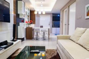 Furnished 1BR Apartment City View Casa Grande Residence By Travelio