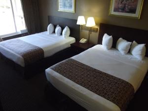 Standard Queen Room with Two Queen Beds room in Ambassadors Inn & Suites