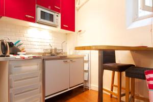 Appartements Studio Saint Sulpice : photos des chambres