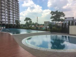 Minimalist Studio The Oasis Apartment near Omni Hospital Cikarang By Travelio
