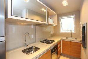 Apartamento com Piscina no Centro e a poucos metros do mar de Torres -RS