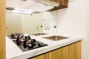 Modern Elegant Studio Grand Kamala Lagoon Apartment By Travelio