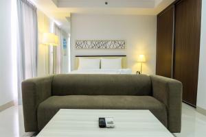 Studio Room Azalea Suites Apartment By Travelio