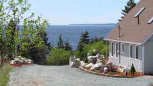 . Ocean View Chalet Overlooking White Point Resort