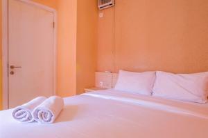 Affordable Price 2BR Green Pramuka City Apartment By Travelio