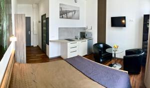 Appartements LITTLE PLAZA Appart'Hotel : photos des chambres