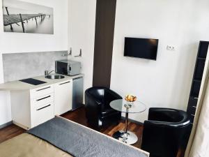 Appartements LITTLE PLAZA Appart'Hotel : photos des chambres