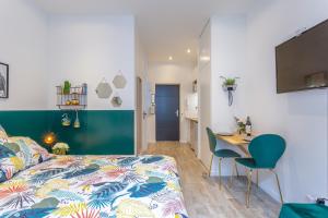 Appartements Les Cocons Emeraude et Fleuri : photos des chambres