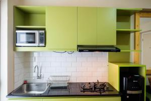 Connect to Pool 2BR Apartment at Bassura City By Travelio