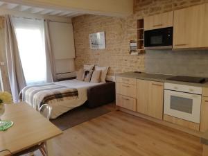 Appartements Le Petit Faubourg : photos des chambres