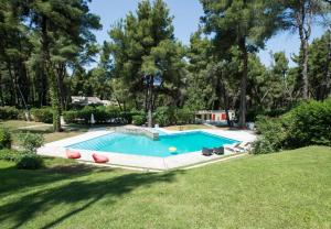 Villa Aurora in Sani with garden and pool
