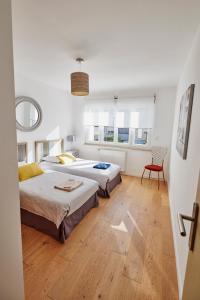 Les Appartements Saint-Michel - centre-ville 2 chambres 90m2 avec garage : photos des chambres