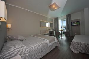 Executive Quadruple Room with Sea View and Beach Package room in Hotel Europa