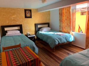 Standard Triple Room room in Hostal Qolqampata