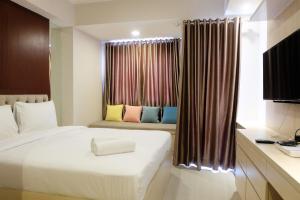 Artistic Studio Apartment at The Oasis Cikarang By Travelio