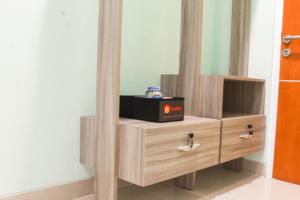 Simple Studio Room at Guest House Way Seputih near Central Park By Travelio