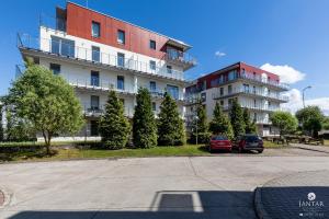 Tolles Familienapartment mit 3 Schlafzimmern einer Terrasse und Garage by Jantar Apartamenty