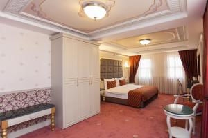 Deluxe Quadruple Room with Balcony room in Meserret Palace Hotel