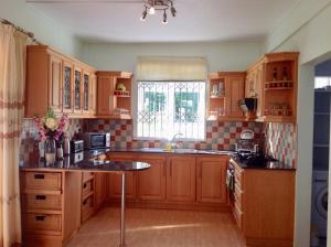 Fayruz Villa is a 3 bedroom, 3 bathroom detached house with AC and swimming pool 5 minutes walk from Flic en Flac public beach