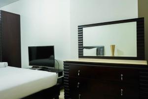 2BR with Study Room at LAvenue Apartment By Travelio