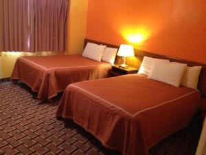 Queen Room with Two Queen Beds room in Red Carpet Inn Niagara Falls