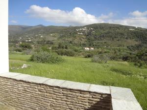 House in the grass land. Andros Greece